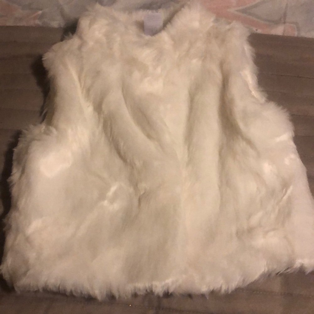 White fur vest
